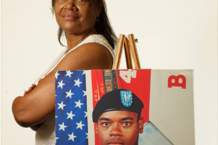 Jackie Dixon with a photo of her son, Army Spec. 4 Anthony Joseph Dixon, who was killed in Iraq. The Anthony Joseph Dixon Resource Center is named in his honor. (Michael Bryant / Staff)
