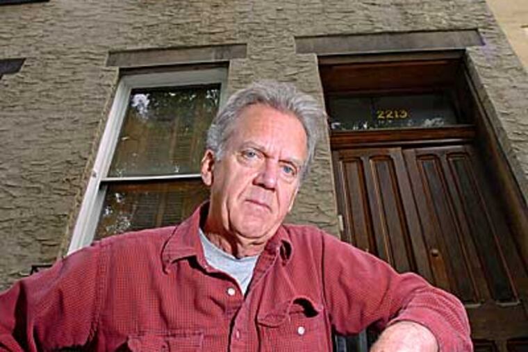 Anthony A. P. Stuempfig stands outside his house on the 2200 block of St. James Place. His assessment stands to dramatically rise with the proposed new tax rules. ( Clem Murray / Staff Photographer )