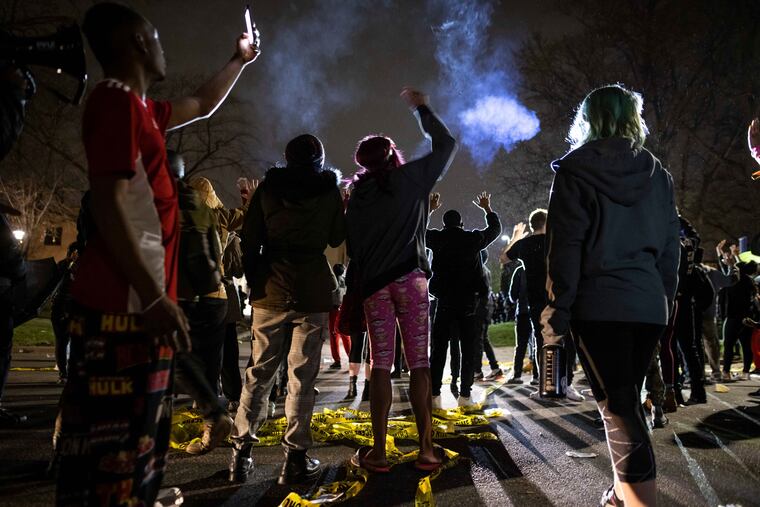 Protesters gather in front of the Brooklyn Center (Minn.) Police station on Sunday after the death of Daunte Wright, 20, during a traffic stop.