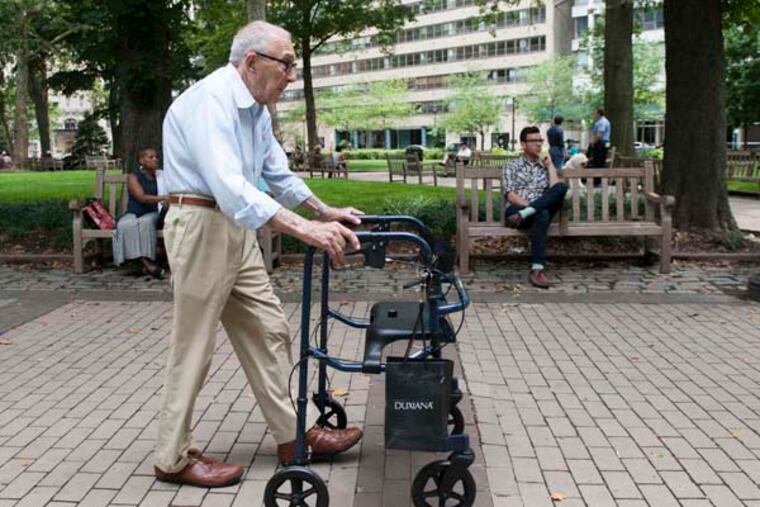 Bernard Evans takes a walk in Rittenhouse Square. Evans volunteers for Penn's Village, a group of senior citizens who live in Center City and choose to live at home.
