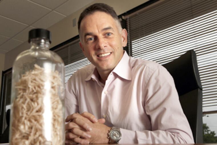 Renmatix CEO Mike Hamilton with a sample of wood product that is
converted to sugars. (Laurence Kesterson / Staff Photographer)