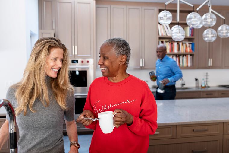 Alex Lerner, left, and B. Smith share a moment as Smith drinks tea in their East Hampton home on Long Island, NY, on Wednesday, Jan. 9, 2019. Smith, 69, has been diagnosed with Alzheimer's. Today, she is cared for by her daughter, Dana Gasby, husband, Dan Gasby, and Lerner, her husband's girlfriend.