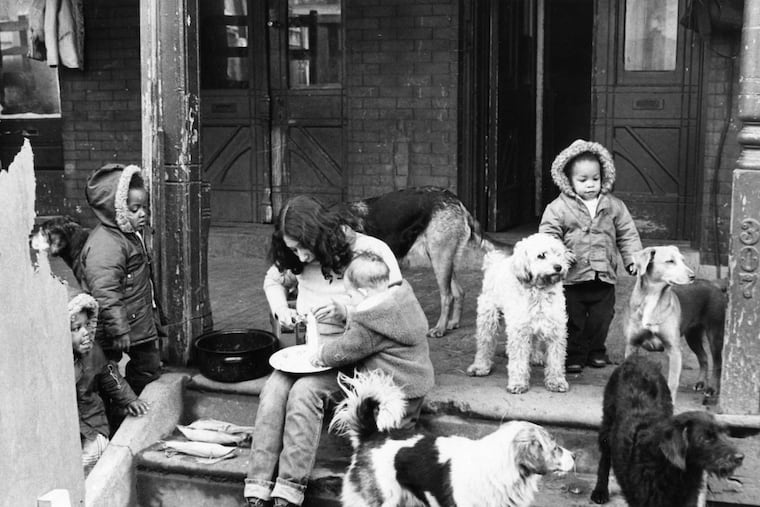 MOVE member Lee Sing and baby Boo Boo Tomasa at the MOVE house on Powelton Ave.