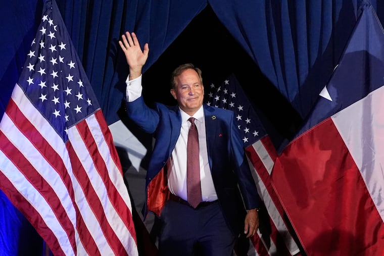 Texas Attorney General Ken Paxton, a Republican candidate for the U.S. Senate, waves as he takes the stage during a primary runoff election night event after winning the Republican party's nomination Tuesday, May 26, 2026, in Plano, Texas.