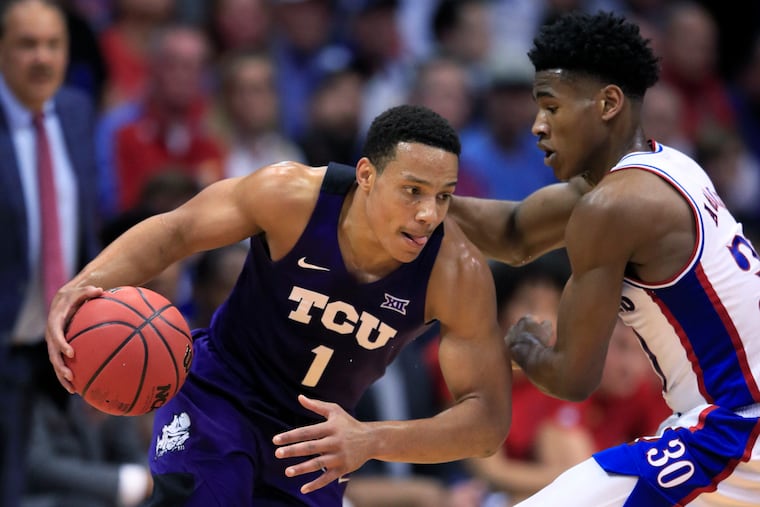 TCU guard Desmond Bane (left) drives on Kansas guard Ochai Agbaji in March. He could go 21st to the Sixers.