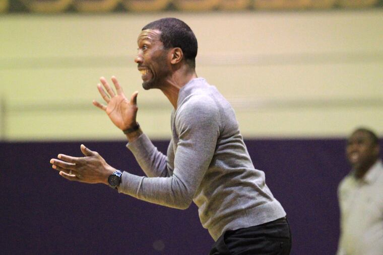 Head Coach Sean Colson of Martin Luther King yells instructions to his team during their game against Imhotep Charter on Jan 18, 2018.