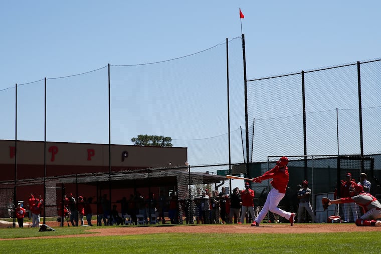 Bryce Harper hits during a simulated game before the Phillies play the Yankees in spring training.