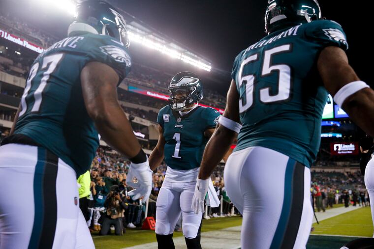 Philadelphia Eagles quarterback Jalen Hurts (1) greets his teammates as they take to the field to play the Dallas Cowboys at Lincoln Financial Field in Philadelphia, Pa. on Sunday, October 16, 2022.