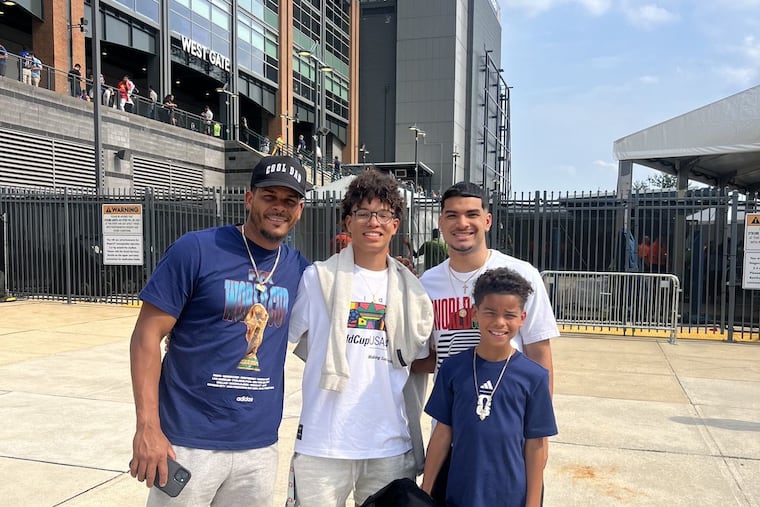 The Meletiche family, including Levi, 9, (bottom right) standing outside Lincoln Financial Field before learning that their World Cup tickets to France vs. Iraq never transferred to their FIFA app. The family was unable to see Kylian Mbappé, Levi's favorite player, make history that day. StubHub has since offered replacement tickets to the family for France's next World Cup game.