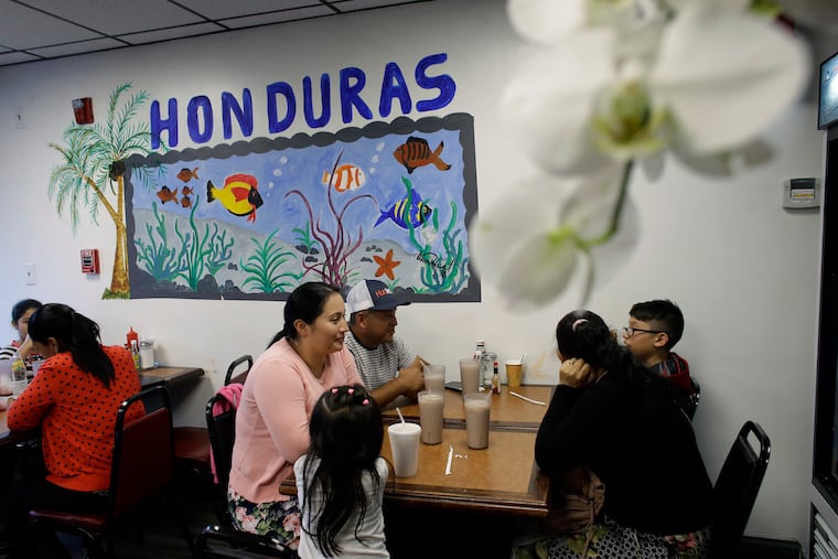In this Thursday, June 27, 2019 photo diners eat in a Honduran-style restaurant in Chelsea, Mass. A recent study by the Pew Research Center shows the number of Central Americans in the United States increased over the last decade. Chelsea has exemplified that trend with a population that is more than 60 percent Latino. (AP Photo/Steven Senne)