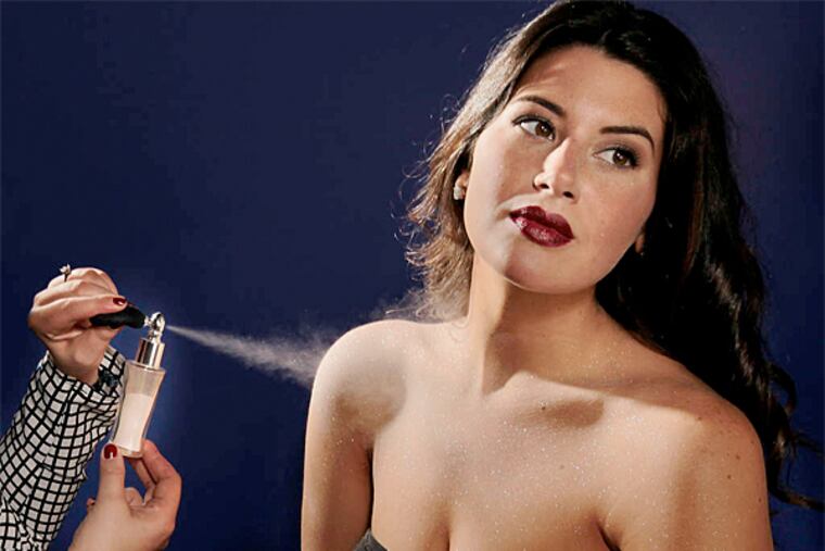 Adrienne Ritchie of Baked tanning salon applies Diamond Dusting to Monet Imperato. November 5, 2014 (Michael S. Wirtz/Staff Photographer)