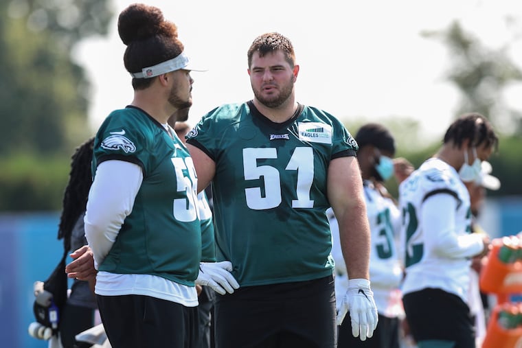 Eagles offensive lineman Landon Dickerson (51) stands on the sideline during the first day of training camp.