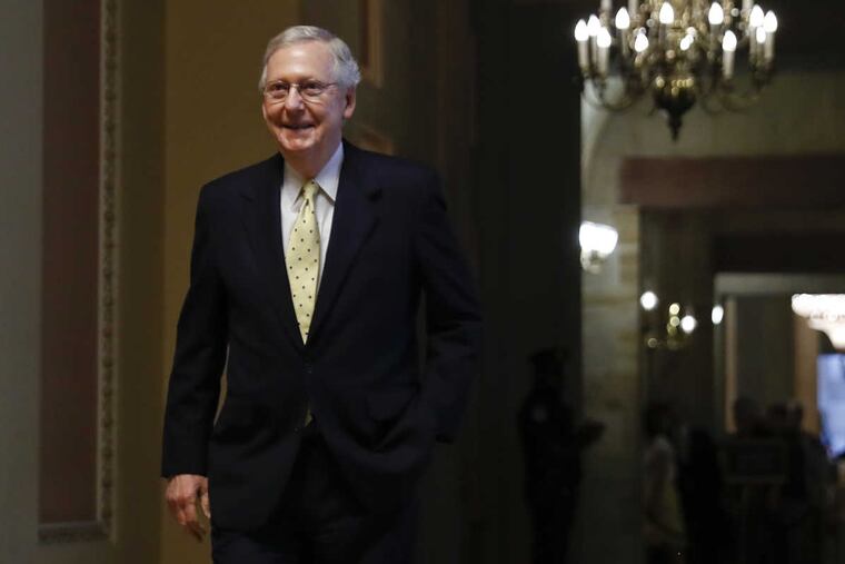 Senate Majority Leader Mitch McConnell of Ky. walks from his office on Capitol Hill in Washington, Tuesday, July 18, 2017.