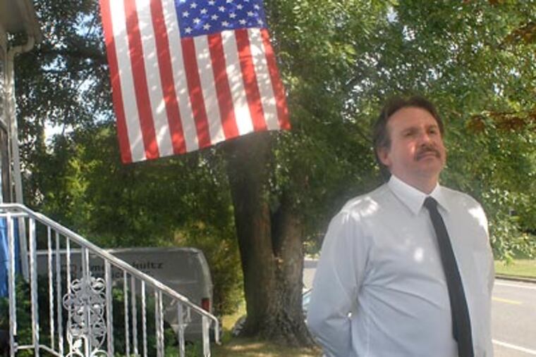 Candidate Lee Lucas outside his home in Gibbstown. He concedes he used a racial slur but said that in a number of contexts, it isn’t wrong. (April Saul / Staff Photographer)