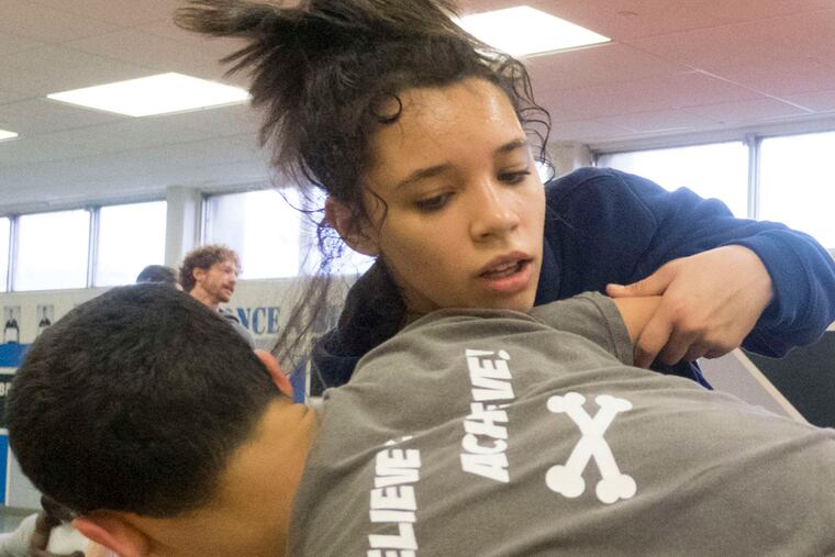 Tatyana Ortiz practices for last weekend's District 12 Class AAA tournament. She lost twice but did not face Father Judge's Tim McCall.