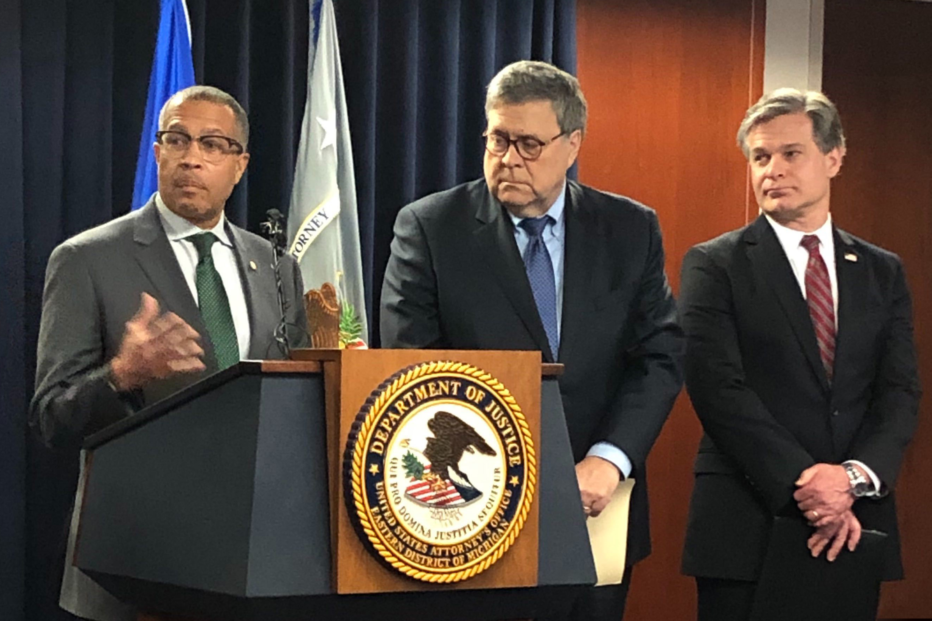 Detroit Police Chief James Craig (left) speaks as U.S. Attorney General William Barr and FBI Director Christopher Wray listen during the announcement of a new national crime reduction initiative on Wednesday in Detroit.