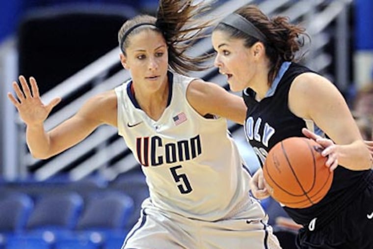 Connecticut's Caroline Doty, left. (AP Photo/Fred Beckham)