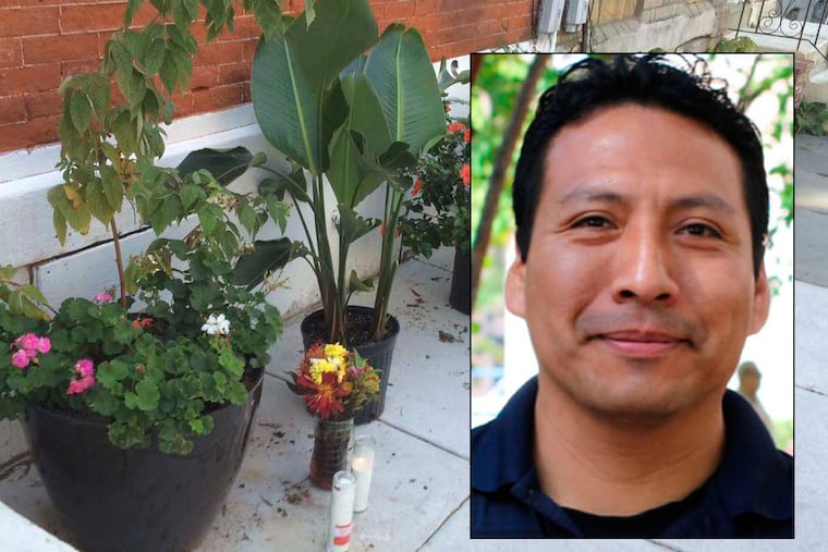 Flowers line the sidewalk outside the home of Manny Andrade, a flower-shop employee and family man fatally shot Friday night.