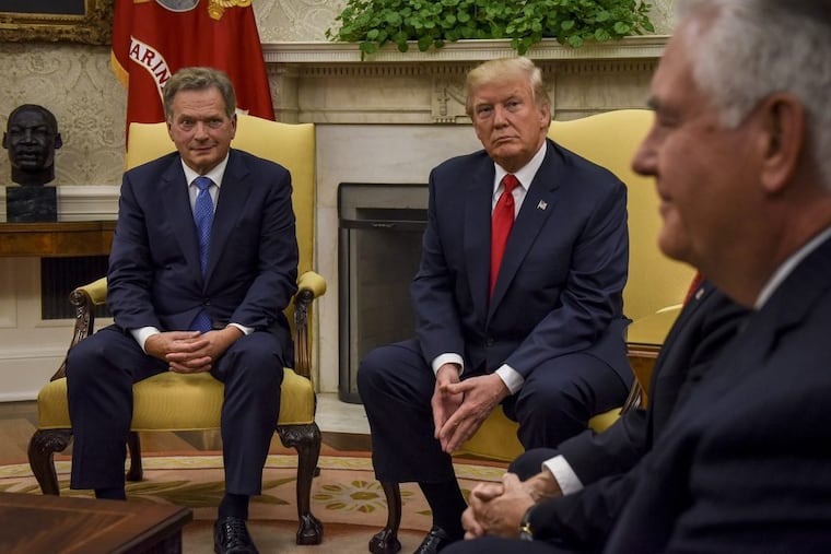 President Donald Trump, center right, with President Sauli Niinistö of Finland, left, and Secretary of State Rex Tillerson, right, in the Oval Office on Monday.