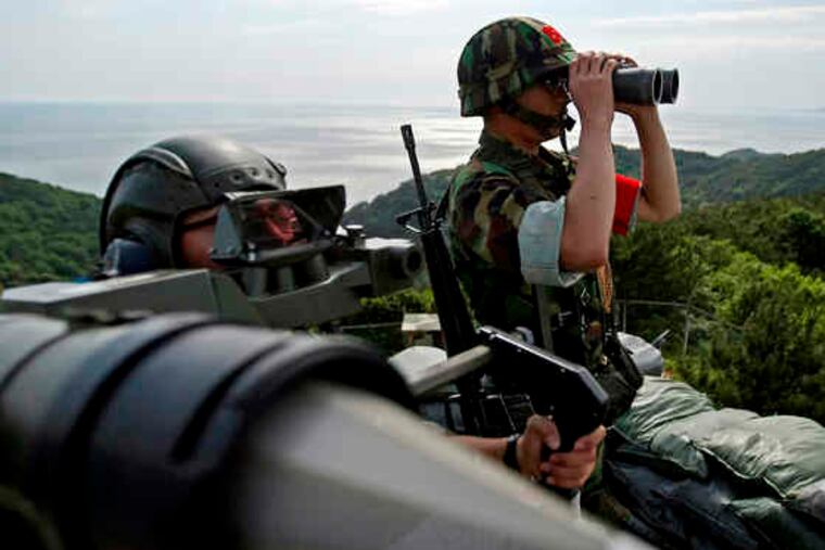 South Korean marines keep watch during a drill against possible attacks by North Korea at the South's western Yeonpyong Island. The South is bracing for a possible third nuclear missile test by the North, despite the new U.N. sanctions.