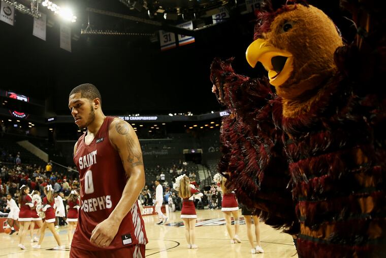 St. Joseph's Lamarr Kimble (0) walks off the court after his team's third-round Atlantic 10 Tournament game against Davidson at the Barclays Center in Brooklyn, N.Y., on Friday, March 15, 2019. St. Joseph's lost 70-60.