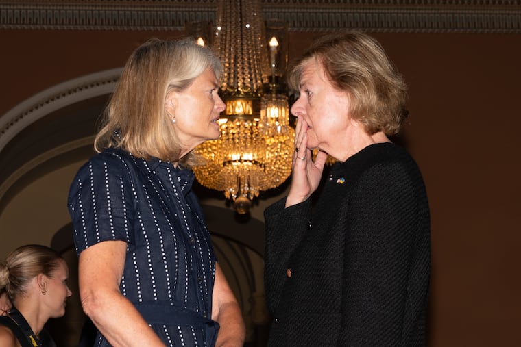 Sen. Lisa Murkowski, R-Alaksa, talks with Sen. Tammy Baldwin, D-Wis., at the U.S. Capitol, Tuesday, July 28, 2026, in Washington.