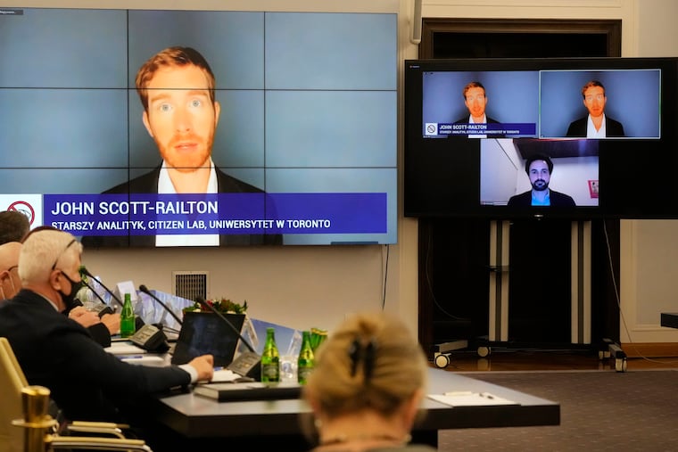 A Polish Senate commission heard the testimony of two cybersecurity experts, John Scott-Railton and Bill Marczak, senior researchers with the Citizen Lab, a research group based at the University of Toronto, in Warsaw, Poland, on Monday, Jan. 17, 2022. The researchers confirmed last month that three Polish critics of the right-wing government were hacked aggressively with Pegasus, spyware produced by Israel's NSO Group. The Senate commission seeks to shed more light on the hacking, which has shocked many in Poland. (AP Photo/Czarek Sokolowski)