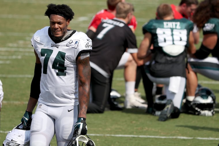 Eagles DE Daeshon Hall walks off the field after Tuesday's joint practice with the Baltimore Ravens.