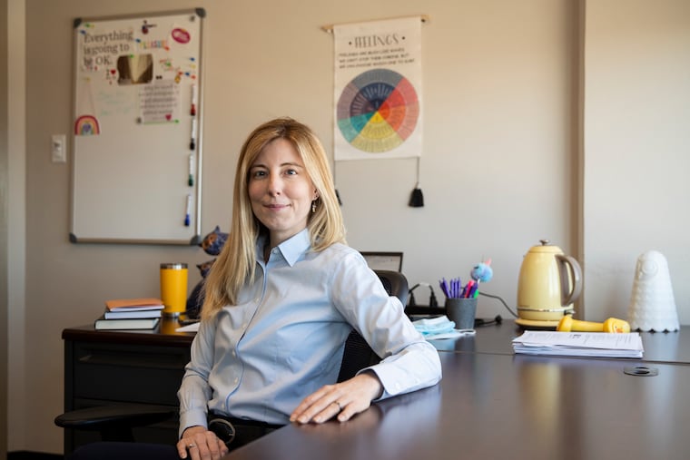 Professor Jenn Pollitt, who teaches Temple's new porn studies class, posed for a portrait in her office.