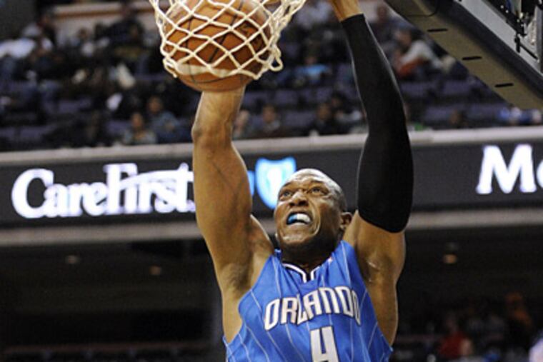 Center Tony Battie, seen here playing with the Orlando Magic, has signed with the Sixers. (AP Photo/Nick Wass)