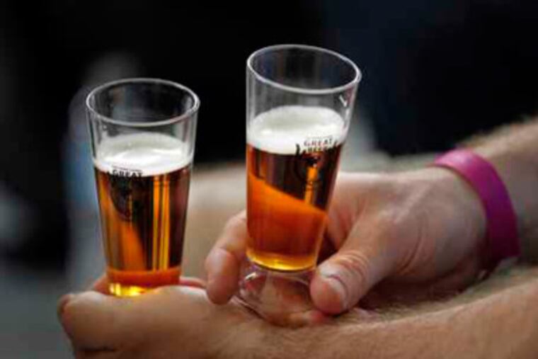 Beer was offered in small sample glasses at the recent International Great Beer Expo at the Navy Yard in Philadelphia. (Laurence Kesterson / Staff Photographer)