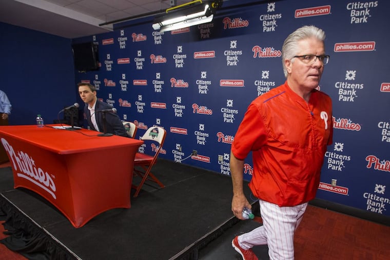 The Phillies General Manager Matt Klentak, left, announced on Sept. 29, 2017, that Phillies Manager Pete Mackanin will not return next year as manager but have an advisory role in the organization. Mackanin leaves the press conference to prepare for tonight’s game against the Mets.