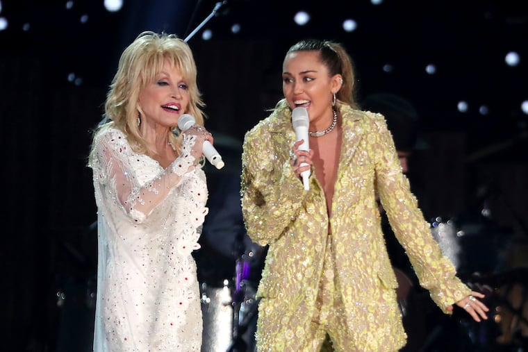 Dolly Parton (left) and Miley Cyrus perform "Jolene" at the Grammy Awards in 2019.