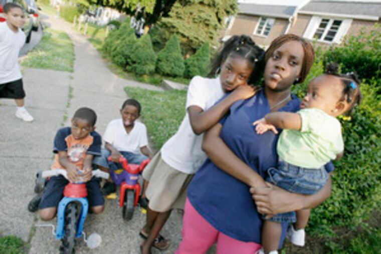 “It’s a burden and a big change when school ends and you’re used to those free lunches,” says Stephanie Coles, with her children (from left) Ronald Freeman, Rhashaun Freeman, Aiyana Coles and baby Amira Freeman.