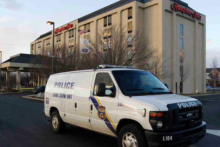 A police van from the Crime Scene Unit pulls away from the Hampton Inn near the airport on Tuesday. Police were investigating the death of a British tourist who they said died this week after a botched procedure to enhance her buttocks.