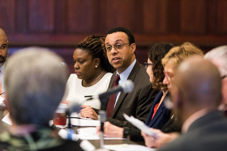 Wendell Pritchett (center) speaks to fellow members of the Philadelphia School Board nominating panel on Feb. 26.