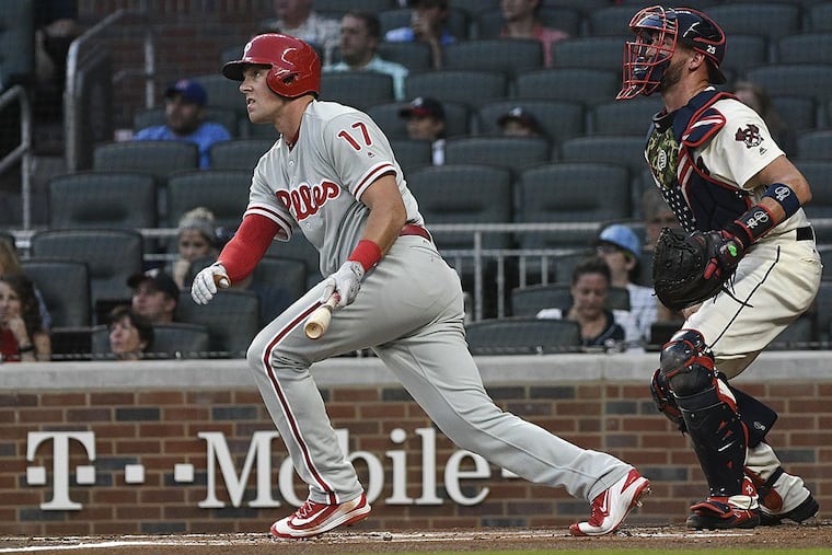 Philadelphia Phillies’ Rhys Hoskins (17) watches his line drive to center field during the first inning of a baseball game against the Atlanta Braves, Saturday, Sept. 23, 2017, in Atlanta. Nick Williams scored on the play.