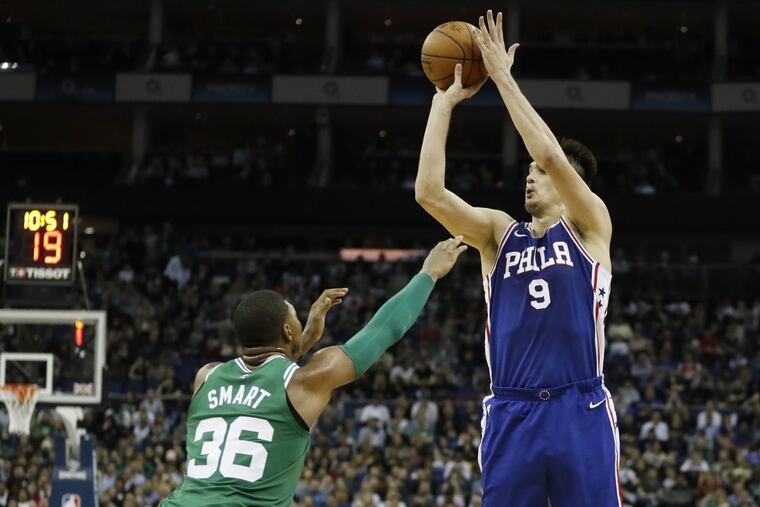 Dario Saric, shooting over Celtics guard Marcus Smart during the game in London.