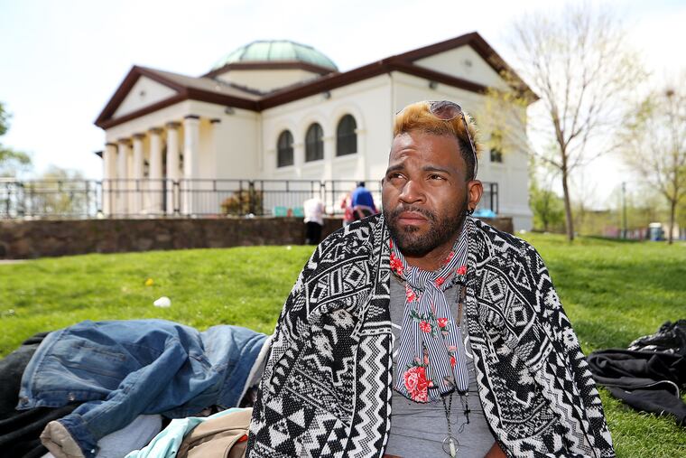 Michael Shelton talks about being recently attacked by a group as he sits in McPherson Square in April. Outreach teams say they are seeing more attacks against homeless people in McPherson Square.