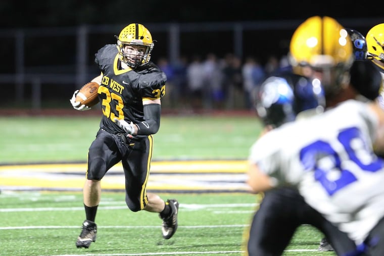 Central Bucks West’s Jake Reichwein (33) picks up yardage in last month’s 20-0 shutout of visiting Quakertown.
