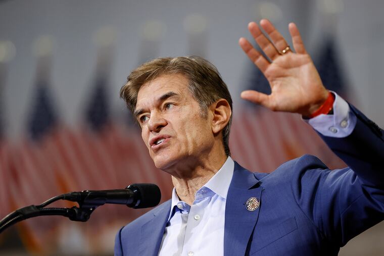 Mehmet Oz waves to supporters during the Save America rally in Wilkes-Barre on Sept. 3, 2022.