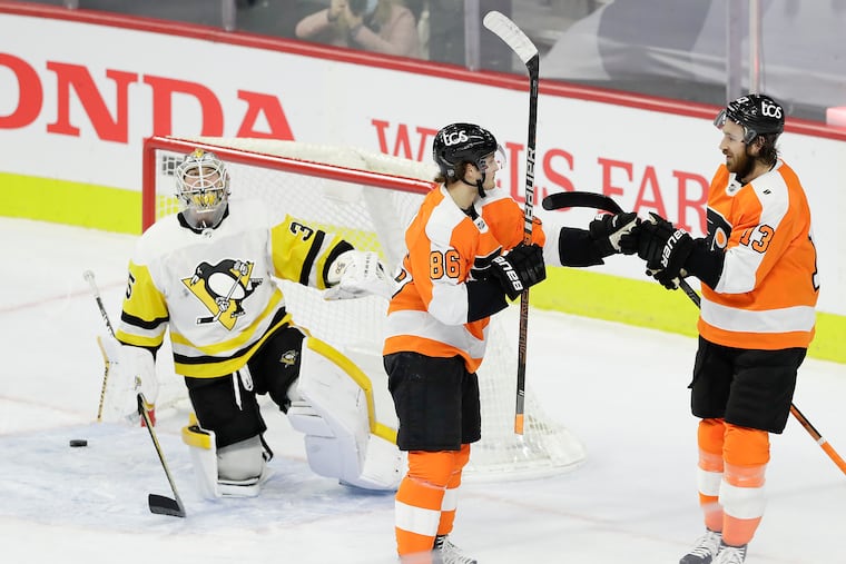 Flyers right wing Joel Farabee (center) celebrates his second-period goal with teammate center Kevin Hayes past Pittsburgh Penguins goaltender Tristan Jarry.