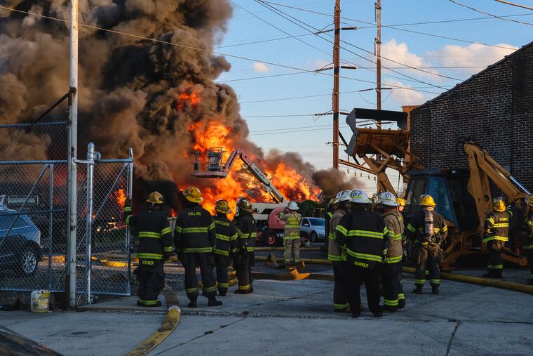 A junkyard fire at Titan Auto Recycling sent pollutants into the air in North Philadelphia on Tuesday.