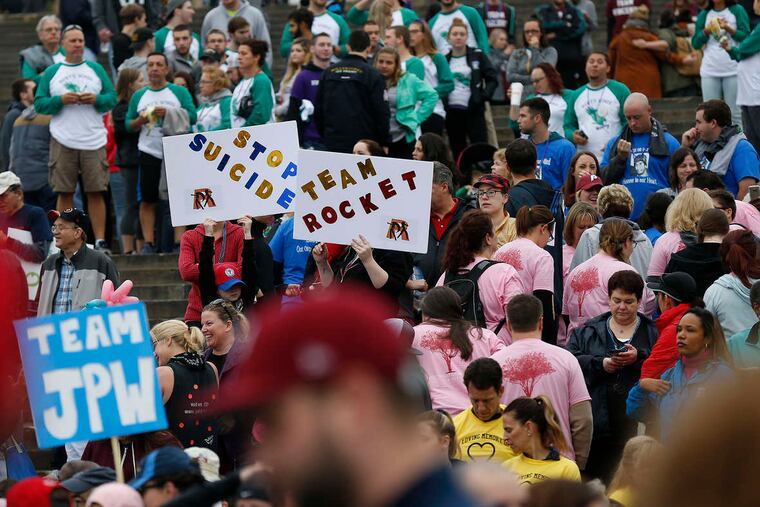 A crowd gathers on the steps of the Philadelphia Museum of Art during the American Foundation for Suicide Prevention's 12th Annual Philadelphia Out of the Darkness Community Walk in Philadelphia, PA on October 2, 2016.