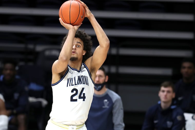 Jeremiah Robinson-Earl of Villanova hits a three-pointer against Marquette at the Finneran Pavilion. Robinson-Earl was 5-5 from beyond the three-point line.
