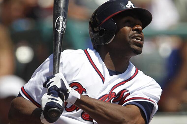 Atlanta Braves' Michael Bourn bats against the New York Mets during a
spring training baseball game in Kissimmee, Fla., Monday, April 2,
2012. (AP Photo/Paul Sancya)