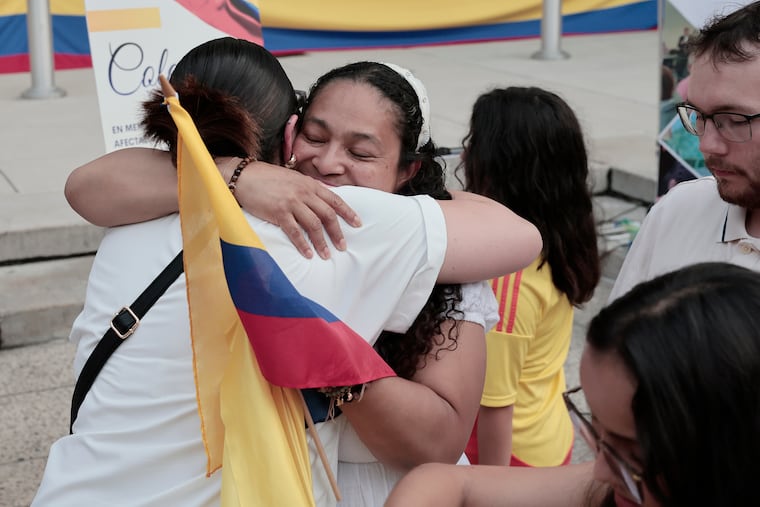 Natalia Mejia (left) and Lili Daliessio (right) hug during the vigil, at Philadelphia’s City Hall, for the people of Columbia on Wednesday, August 12, 2026. A powerful 7.4 magnitude earthquake hit the country earlier this week.