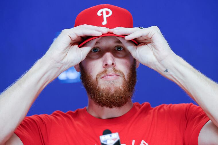 Phillies pitcher Zack Wheeler, who will start Game 2, adjusting his cap before meeting with the media on Tuesday.