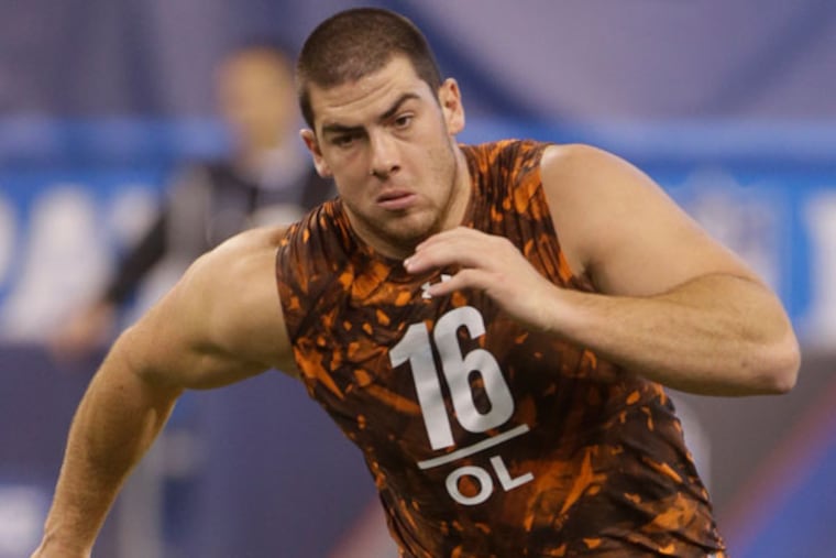 Central Michigan offensive lineman Eric Fisher runs a drill during the NFL football scouting combine in Indianapolis, Saturday, Feb. 23, 2013. (Dave Martin/AP file)