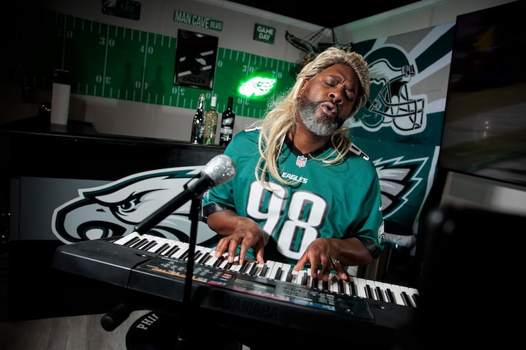 Robert Williams III plays his keyboard in his Severn, Md., man cave wearing a blond wig he uses when he's dressed like Daryl Hall to cover Hall & Oates songs. Williams' social media videos marry sports and musical parodies.